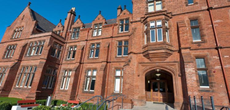 Riddel Hall against a blue sky