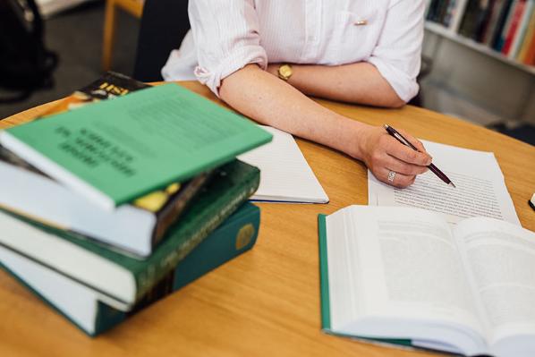 Lecturer pointing at papers