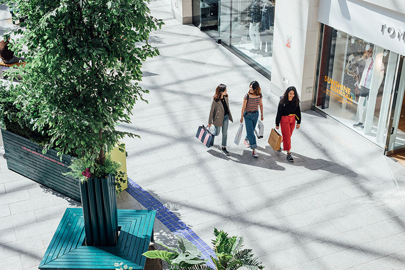 Female students with shopping bags in Victoria Square