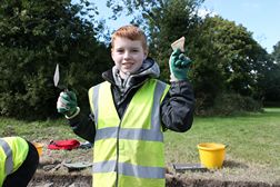 Odran Johnston with a piece of green glazed medieval pottery