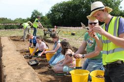 Members of the local community digging at the fort