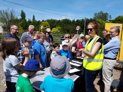 Georgia showing locals the artefacts during the Open Day