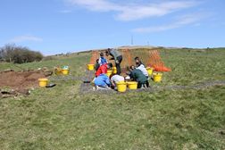 Colaiste  Feirste excavating at Squires Hill