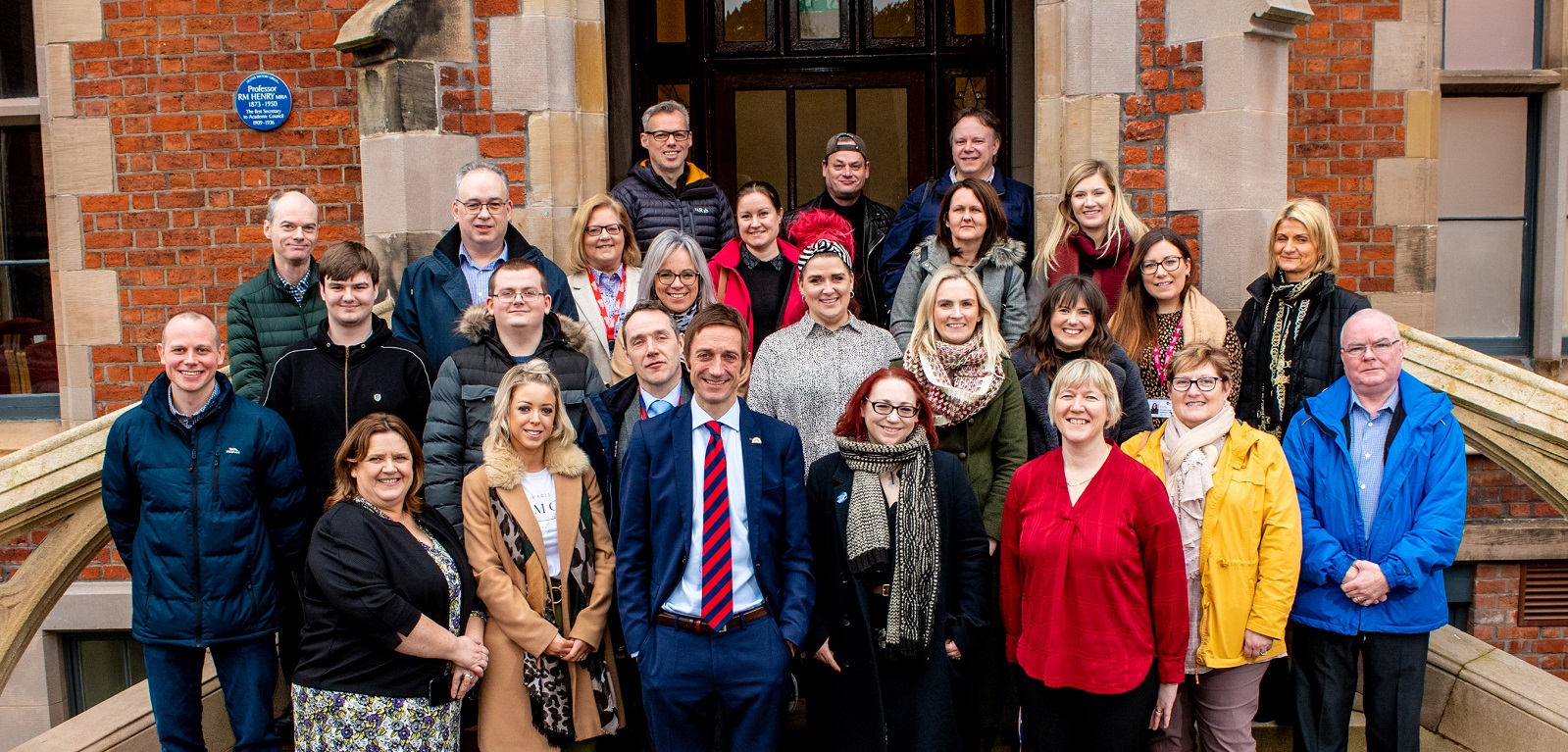 Staff and partners group celebrating 5 years of QUB Inclusive Employment