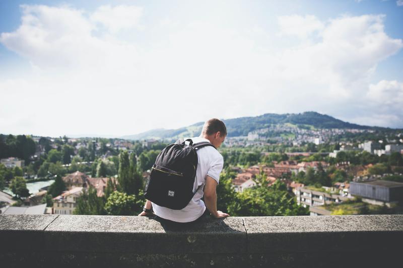 Student looking over a view of a town