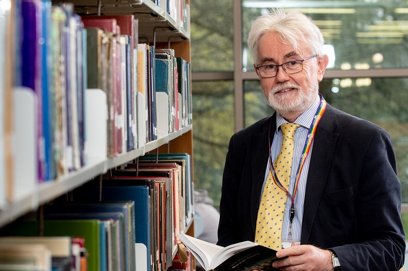 Paddy Brannigan, Manager, Information Services Directorate, Queen's University Belfast, pictured beside a stack of book shelves in the McClay Library at Queen's