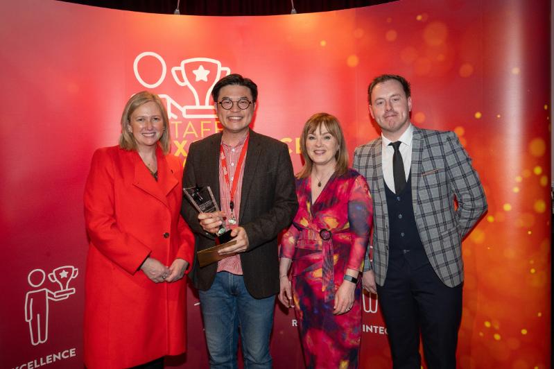 Image shows Co-Chairs of the Staff Excellence Awards Judging Panel, Gillian Magee and Mairead Regan, with winner Dr Ving Fai Chan and host Andrew Ryan