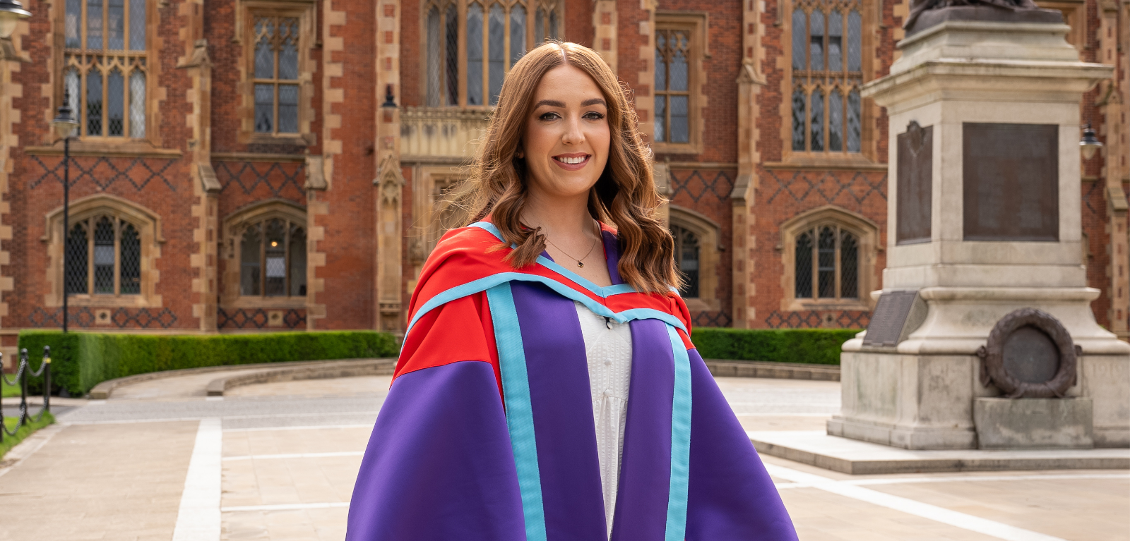 Dr Steph Craig outside Lanyon in robes
