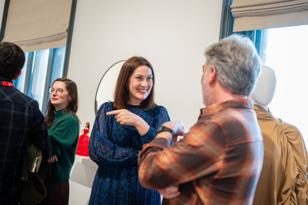 staff chatting at the launch of Queen's new Staff Network for Promoting Linguistic Diversity and Minority Languages, in the Naughton Gallery