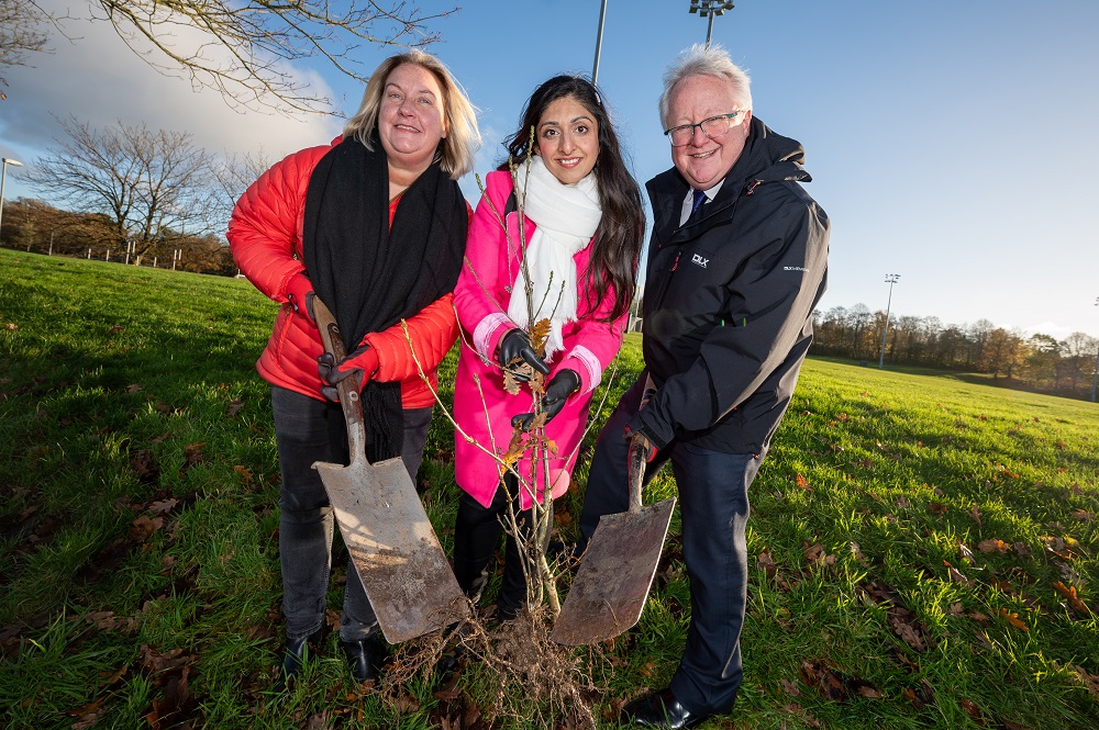 left to right: Marelle Crawford, Natasha Sharma and Michael Alcorn planting trees at Malone Playing Fields, November 2023