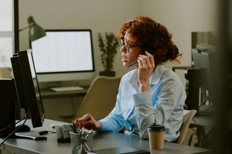 woman wearing a headset participating in an online meeting or call