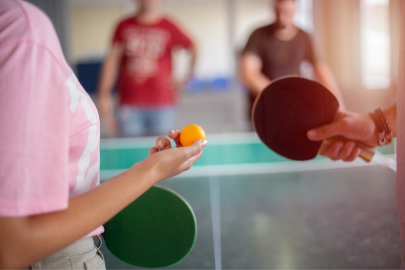 people playing doubles table tennis